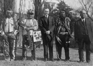 Pres. Calvin Coolidge and four Osage Indians at the White House, June 2, 1924