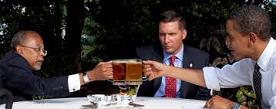 Henry Louis Gates Jr. (1950-) et al. drink beer with Pres. Obama